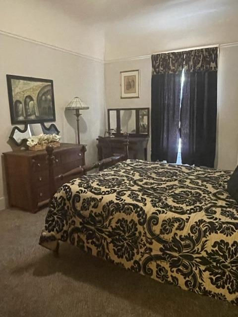 42943 Road 114 Dinuba, CA 93618 - Photo 12 of 40 a bed sitting in a bedroom next to a window and dresser