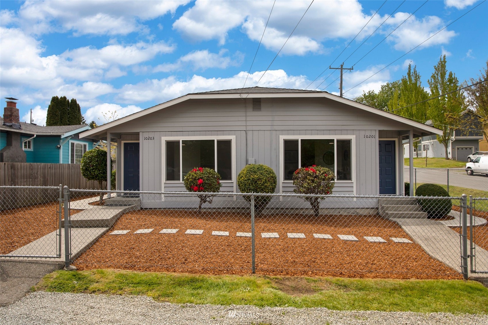 a view of a house with backyard sitting area and porch