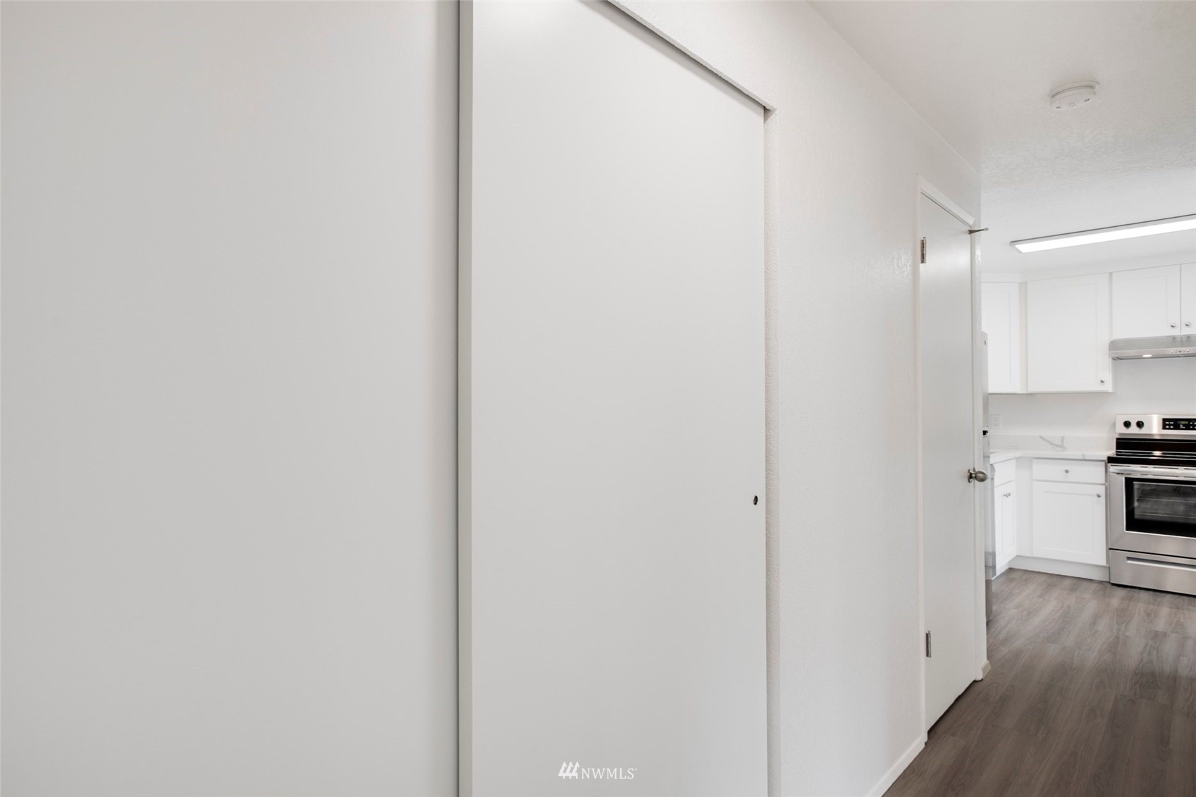 10201 17th Avenue Southwest Seattle, WA 98146 - Photo 20 of 25 a view of a kitchen from a hallway