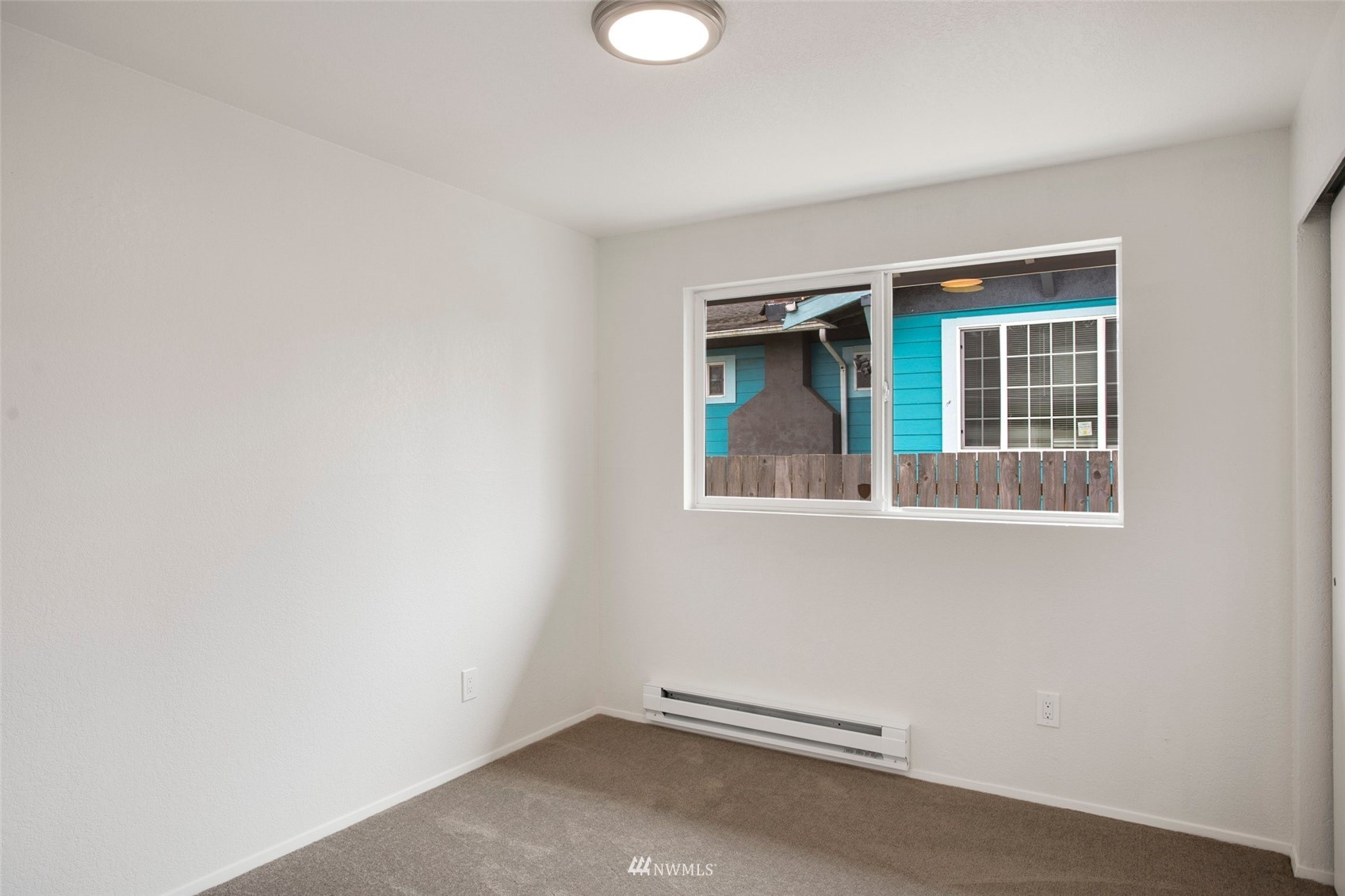 10201 17th Avenue Southwest Seattle, WA 98146 - Photo 21 of 25 an empty room with a window
