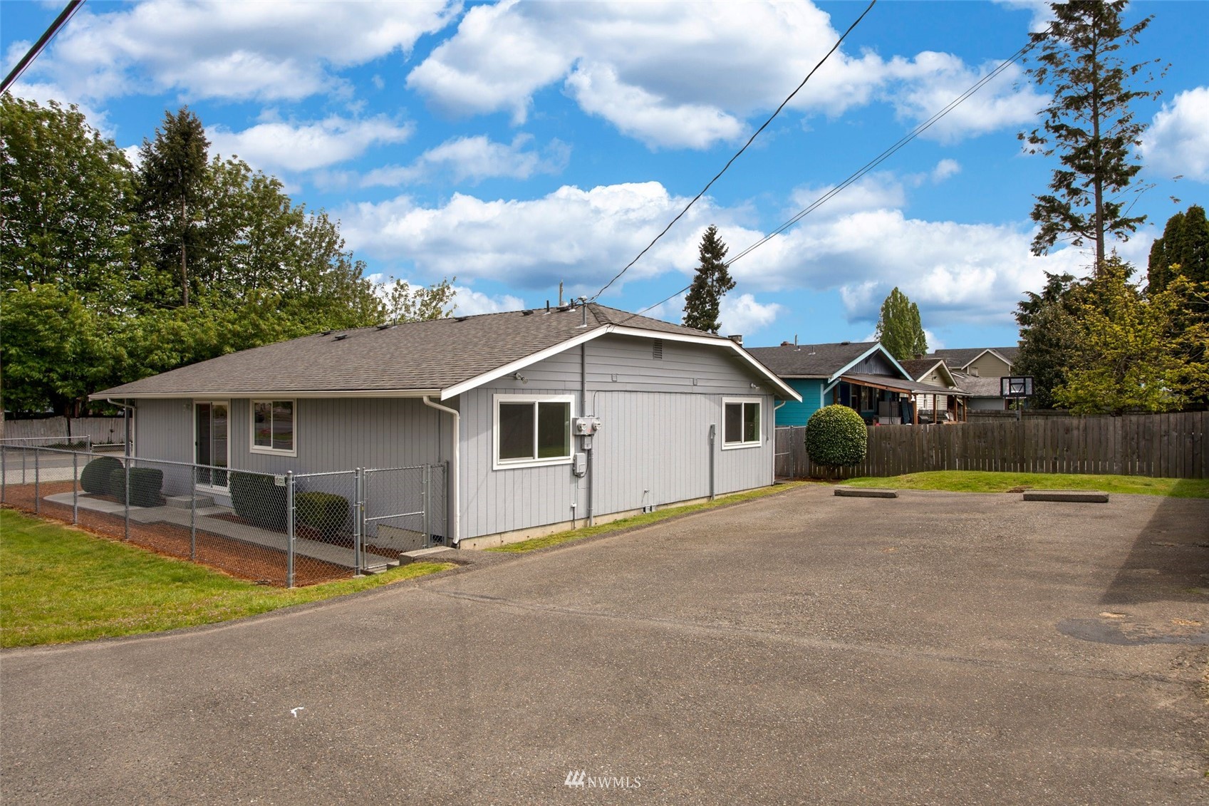 10201 17th Avenue Southwest Seattle, WA 98146 - Photo 25 of 25 a view of a house with swimming pool and a yard