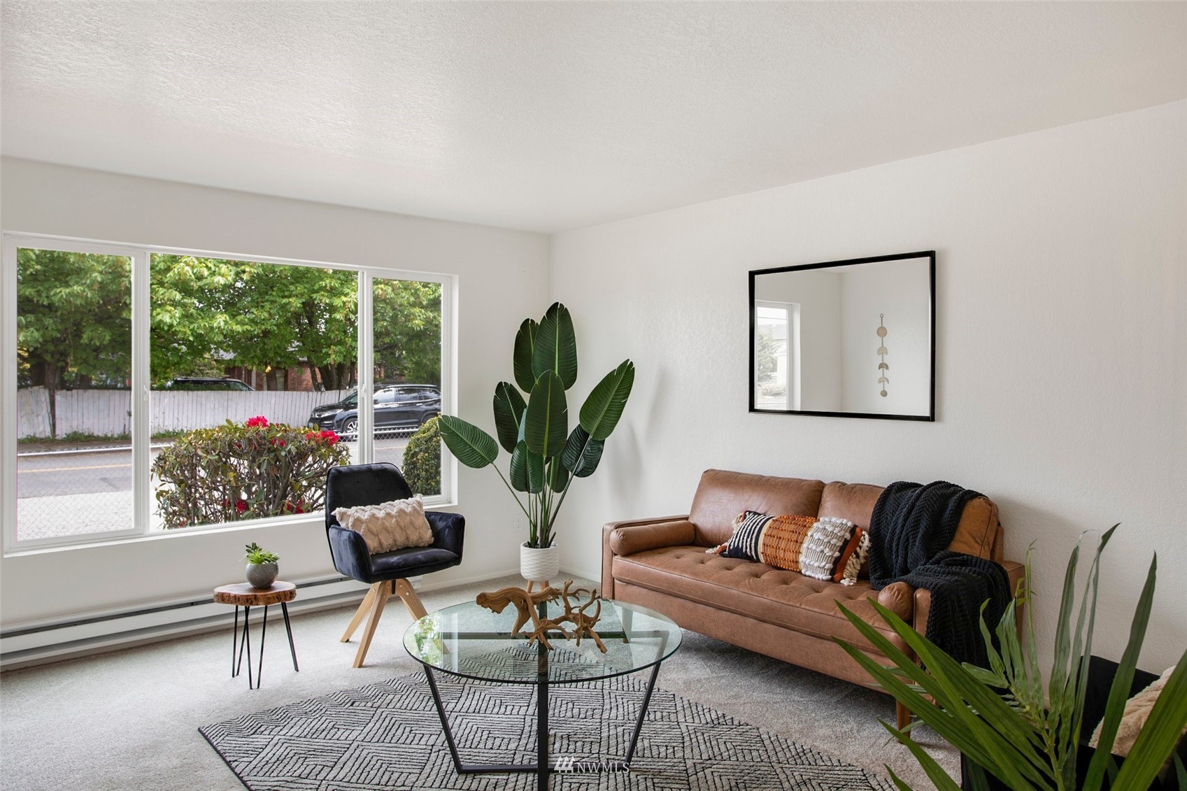 10201 17th Avenue Southwest Seattle, WA 98146 - Photo 3 of 25 a living room with furniture potted plant and a window