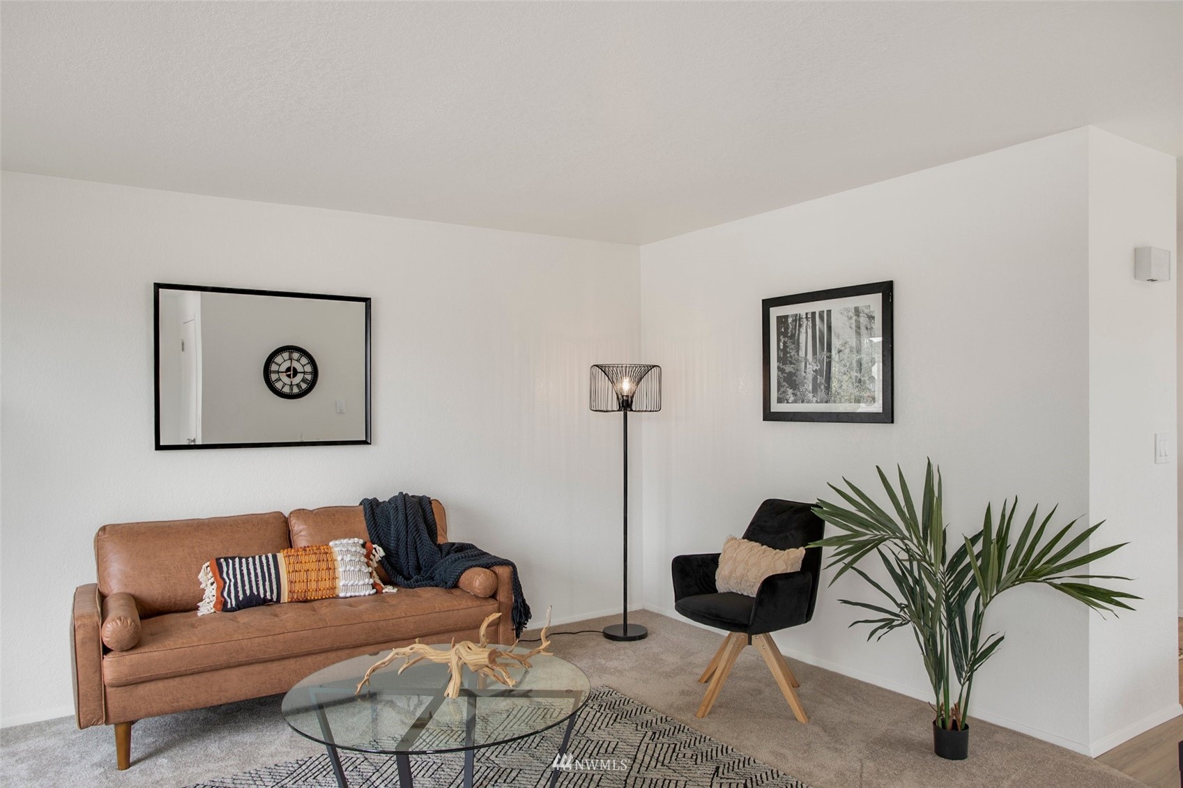 10201 17th Avenue Southwest Seattle, WA 98146 - Photo 4 of 25 a living room with furniture and a potted plant