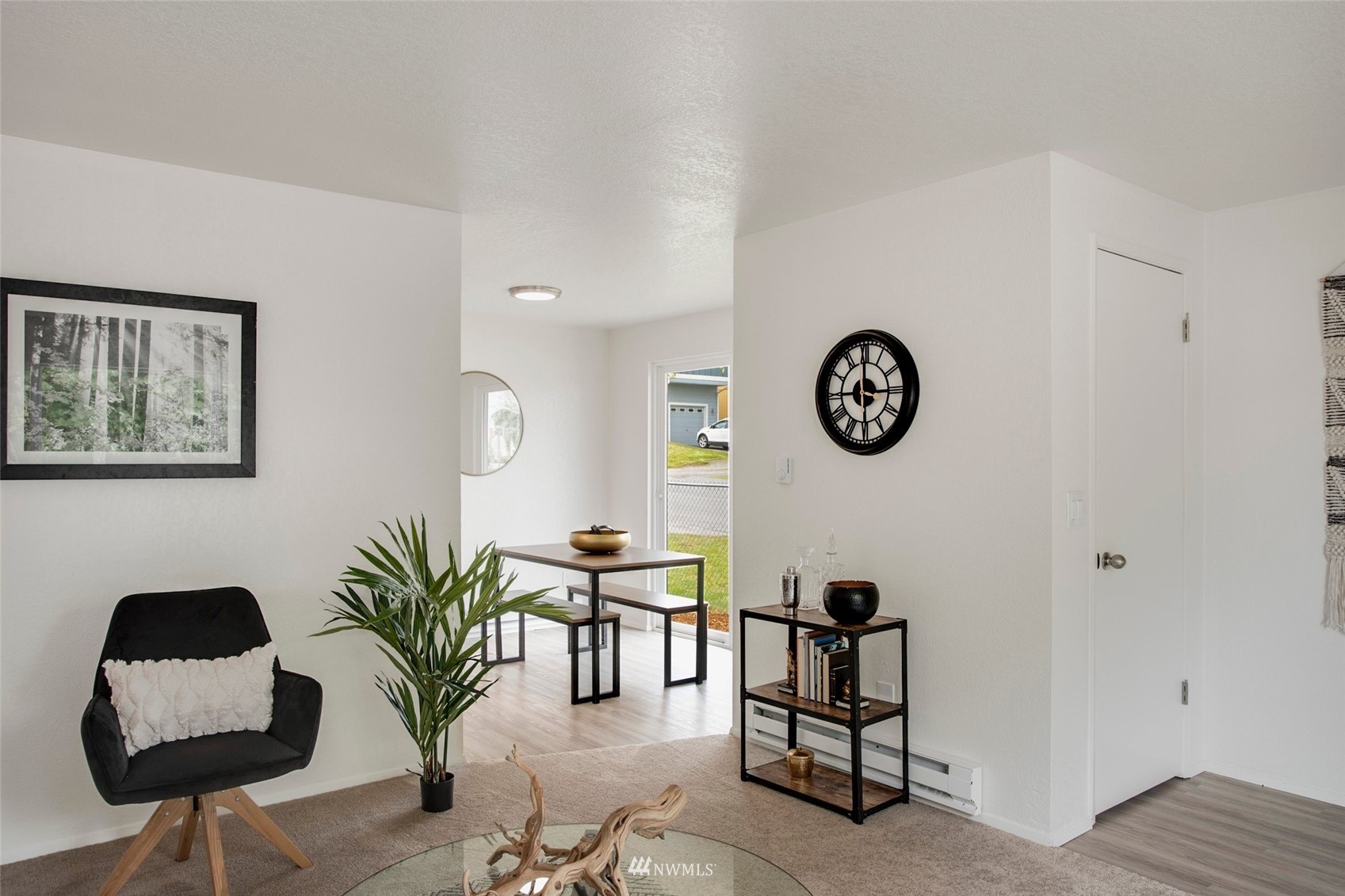 10201 17th Avenue Southwest Seattle, WA 98146 - Photo 5 of 25 a living room with furniture and a potted plant