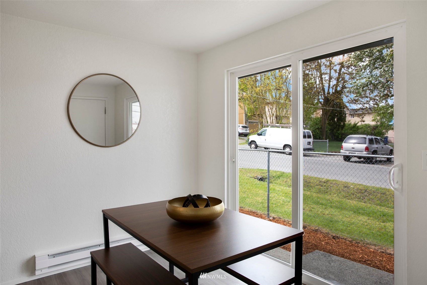 10201 17th Avenue Southwest Seattle, WA 98146 - Photo 6 of 25 a view of a dining room with furniture and a window