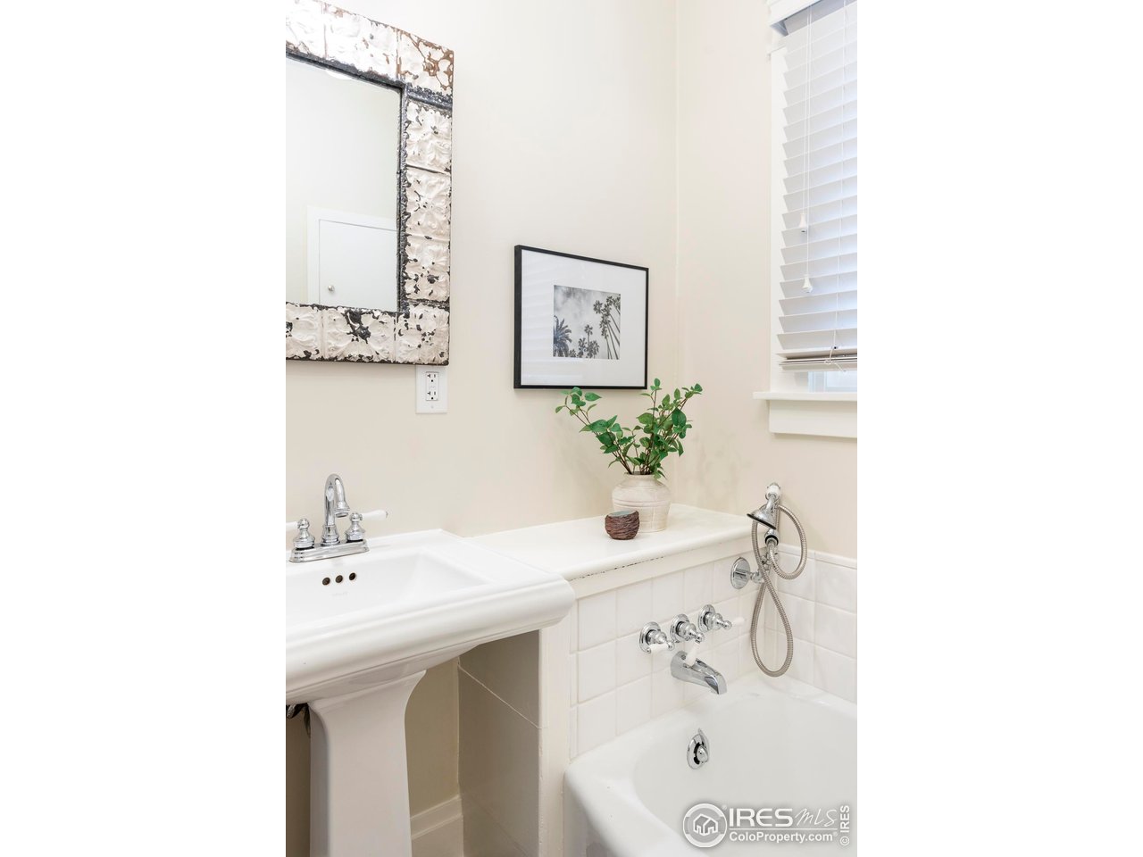 721 9th Street Boulder, CO 80302 - Photo 15 of 40 a bathroom with a sink and a mirror