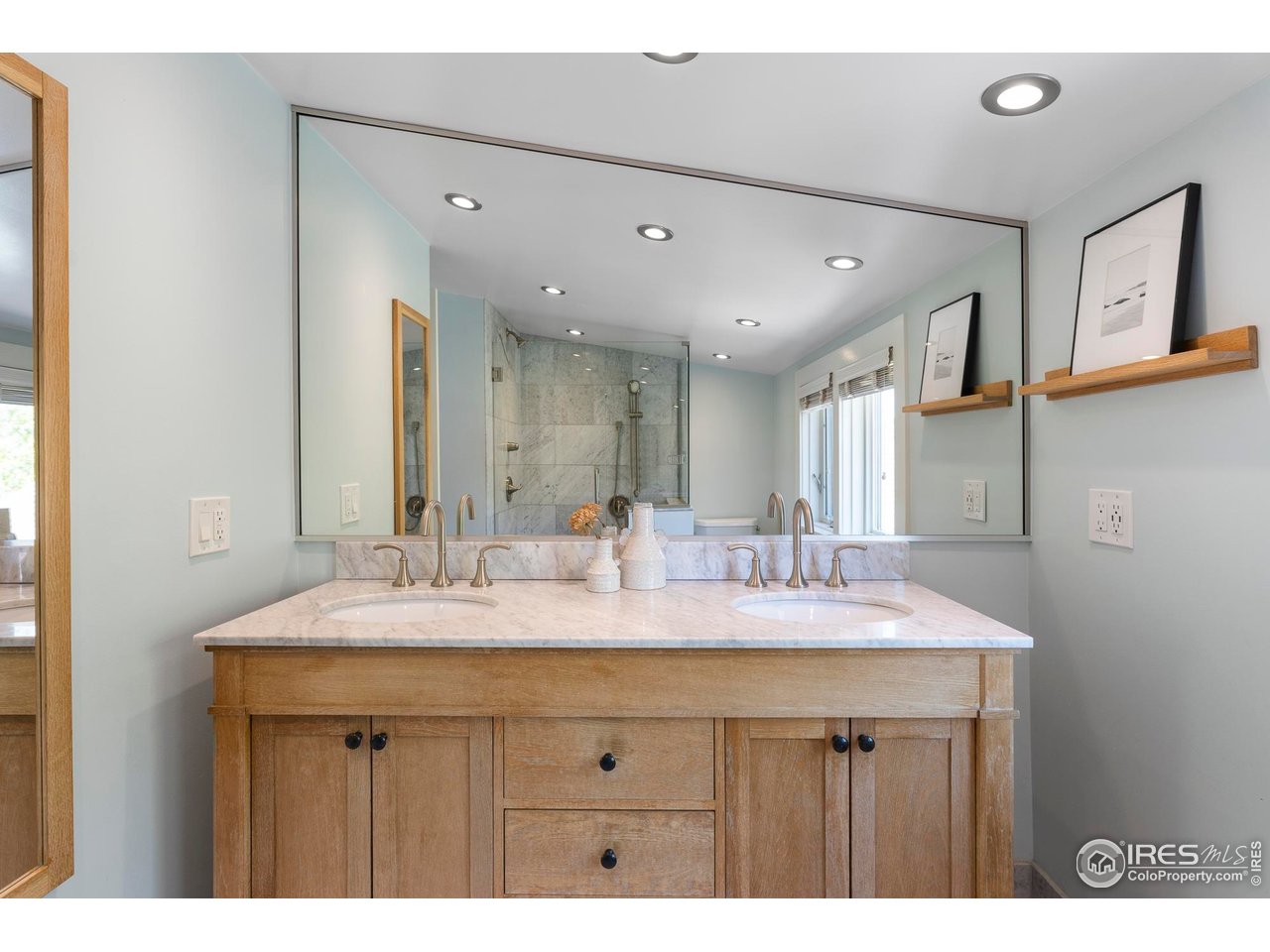721 9th Street Boulder, CO 80302 - Photo 19 of 40 a bathroom with a sink double vanity and a mirror