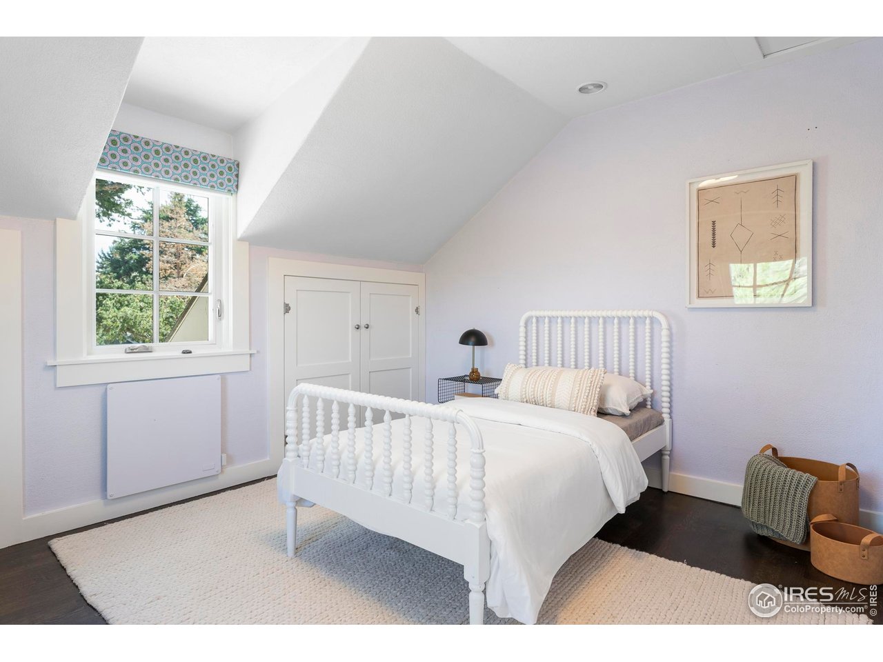 721 9th Street Boulder, CO 80302 - Photo 21 of 40 a bedroom with a bed and a chair