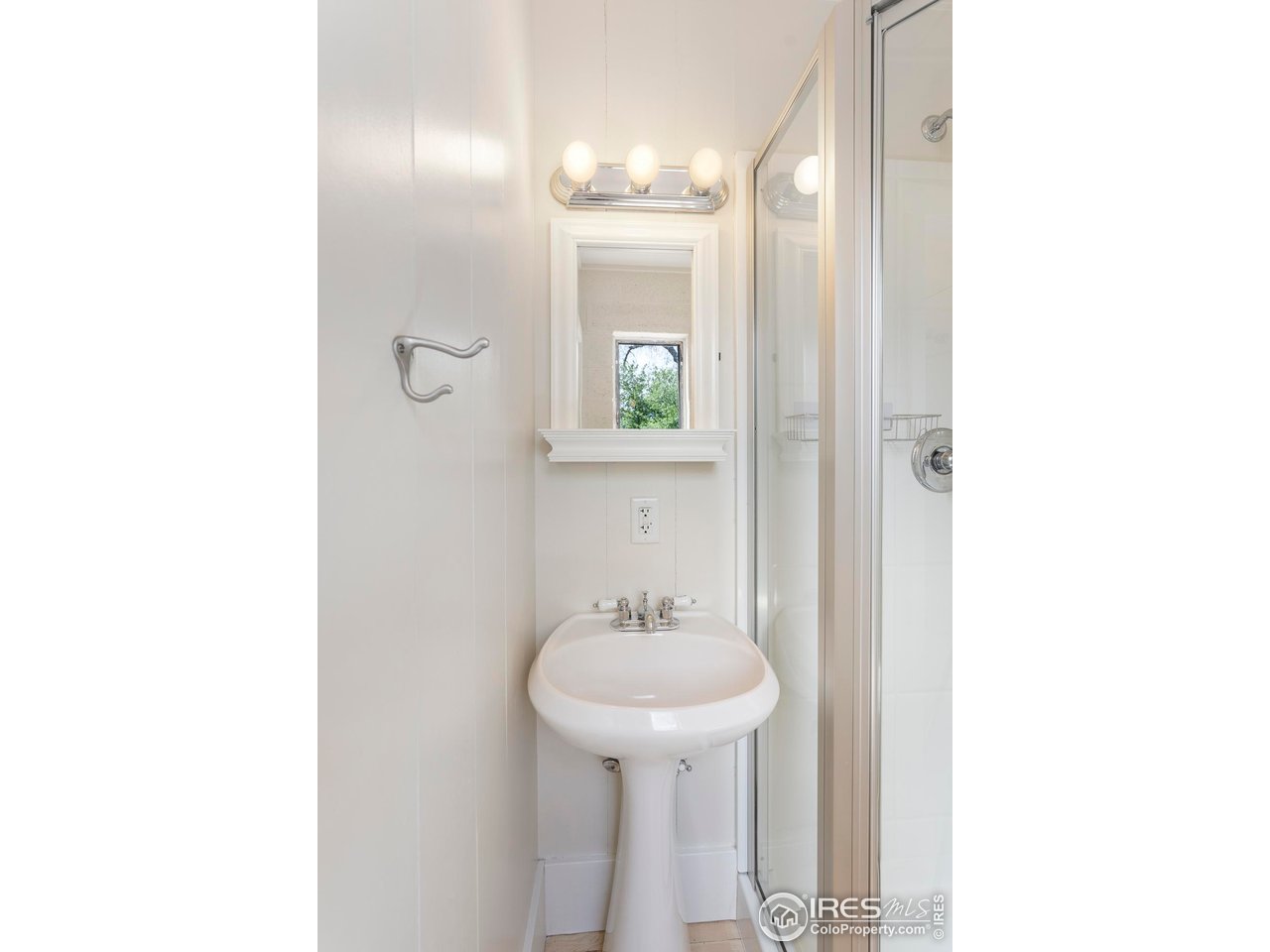 721 9th Street Boulder, CO 80302 - Photo 27 of 40 a bathroom with a sink and a mirror