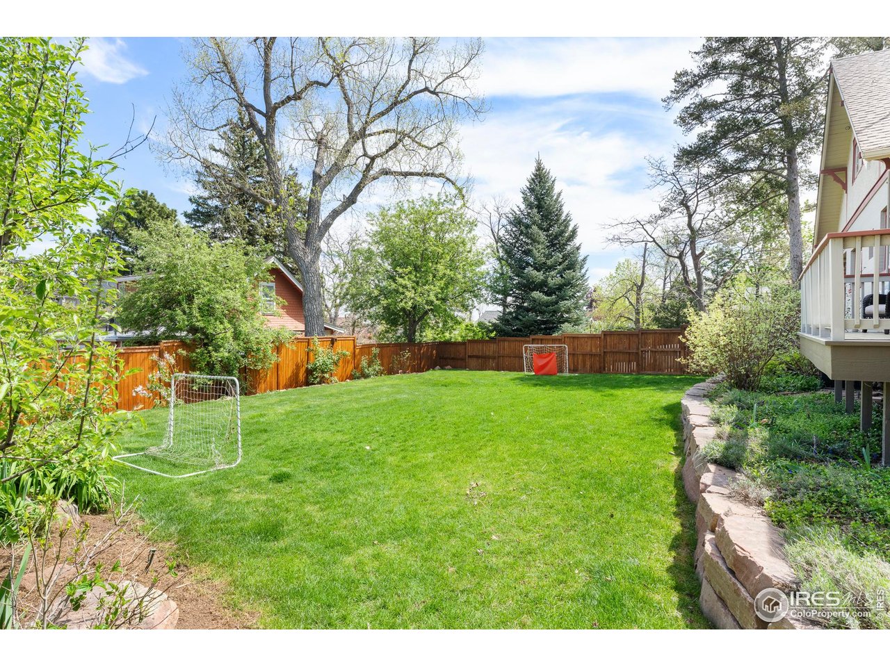 721 9th Street Boulder, CO 80302 - Photo 30 of 40 a garden with trees in front of it