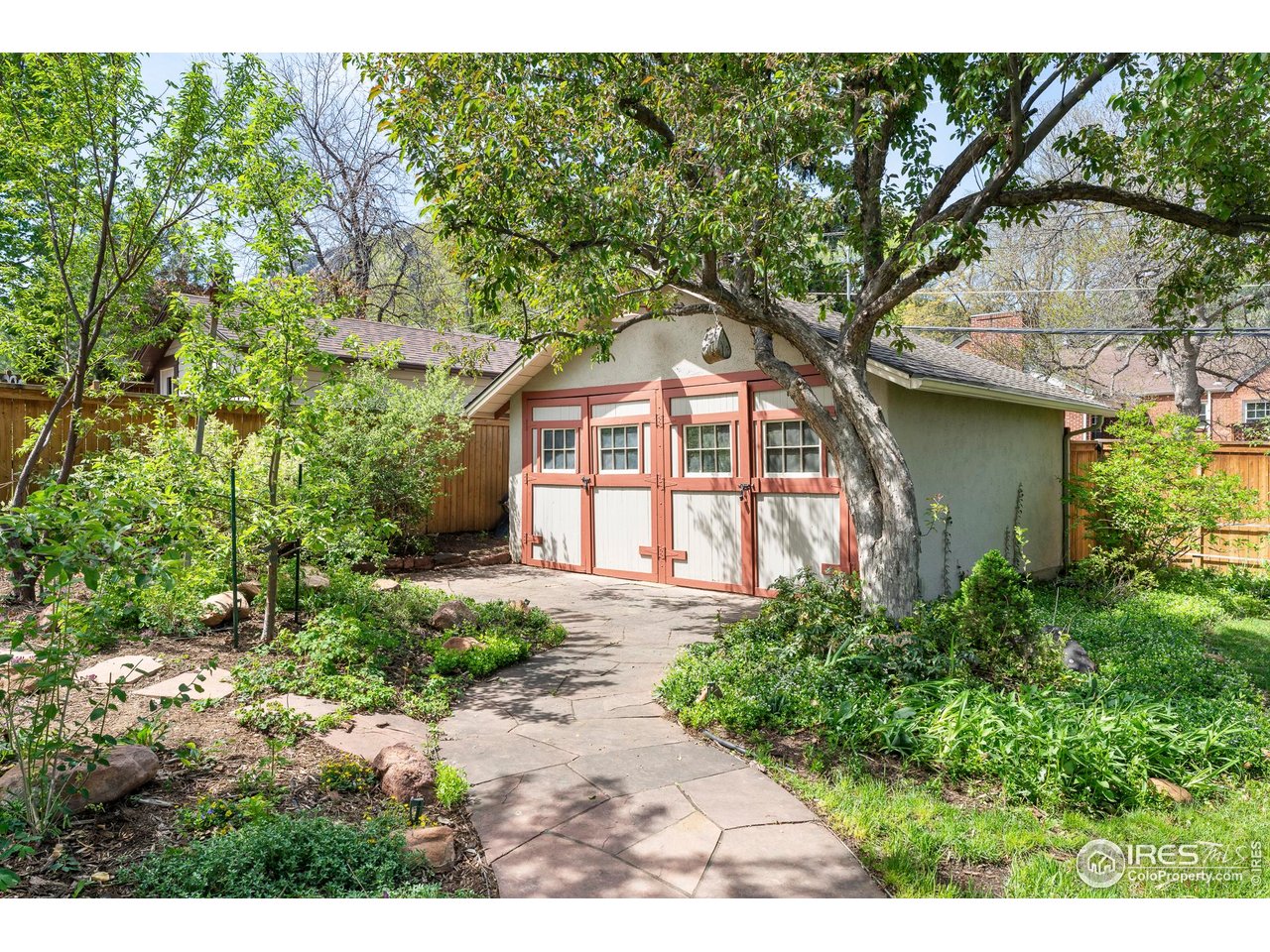 721 9th Street Boulder, CO 80302 - Photo 32 of 40 a front view of a house with a garden