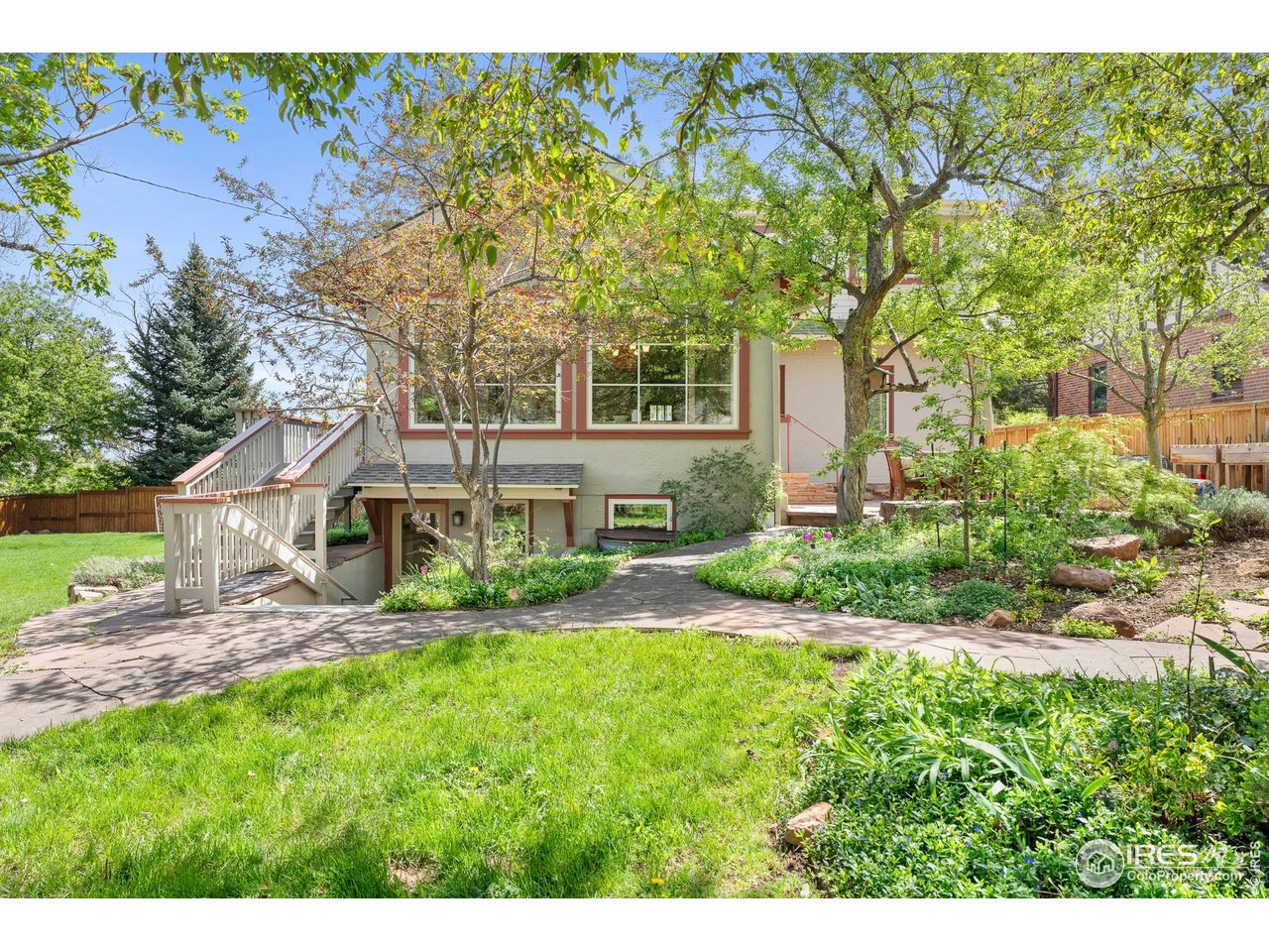721 9th Street Boulder, CO 80302 - Photo 35 of 40 a front view of a house with a yard