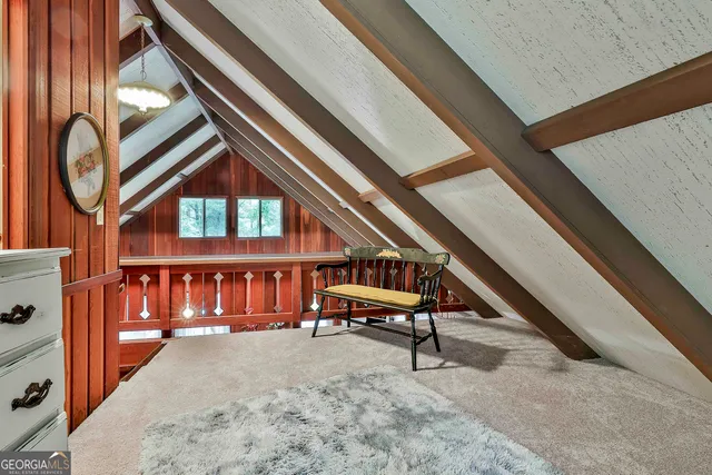 a view of an chairs and bench in the balcony
