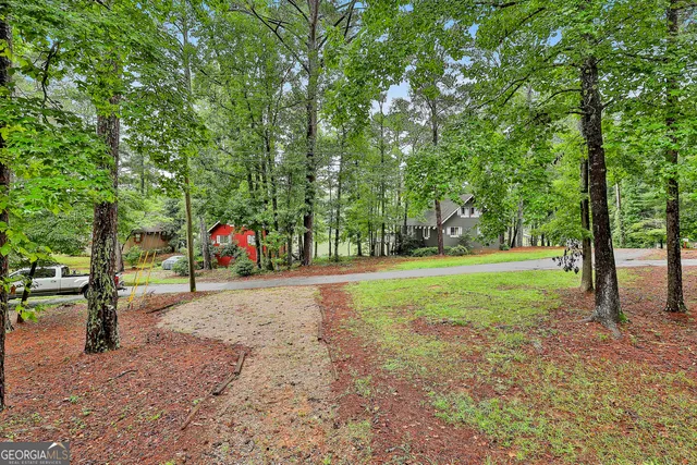 a view of a park with swings and slides