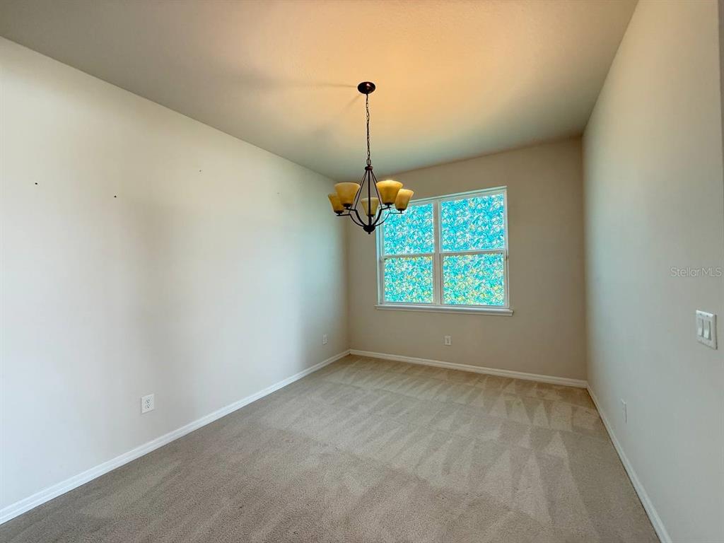14112 Poke Ridge Drive Riverview, FL 33579 - Photo 12 of 32 a view of an empty room with a window