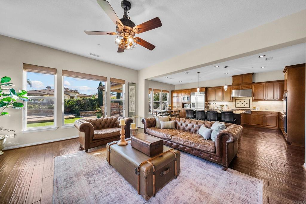 20300 West Vía Urbino Porter Ranch, CA 91326 - Photo 1 of 1 a living room with furniture and a large window