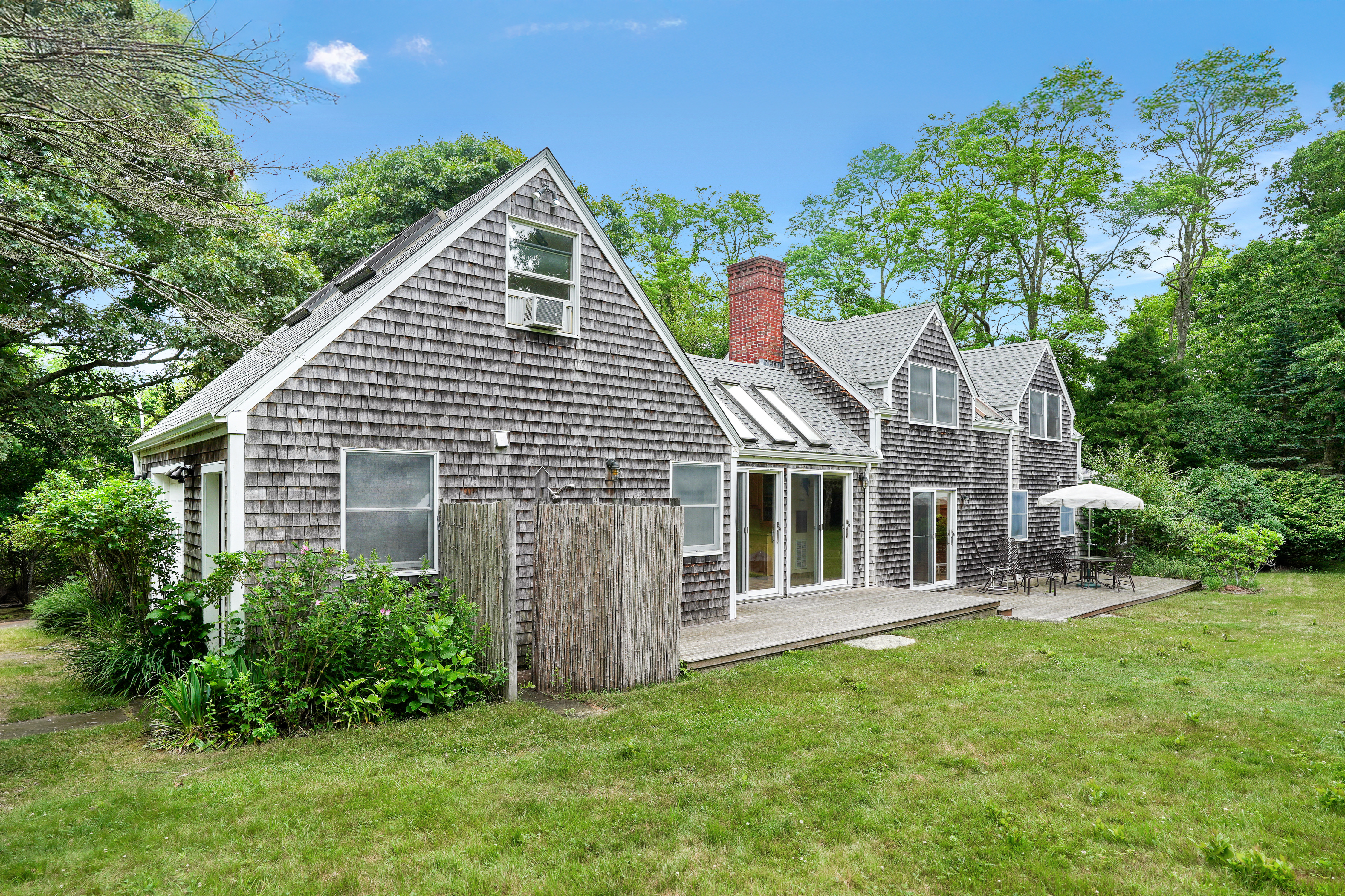 174 Middle Road Chilmark, MA 02535 - Photo 2 of 40 a view of a house with a yard and porch