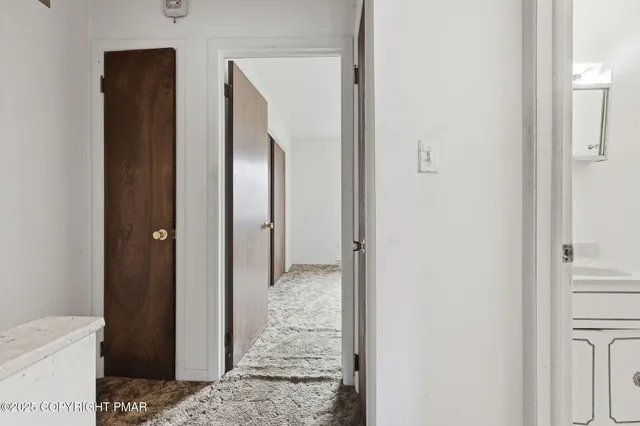 a view of a bathroom from a hallway