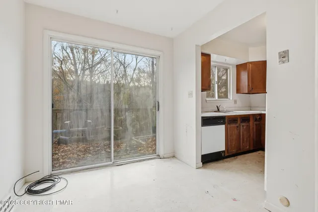 a bathroom with a granite countertop sink and mirror