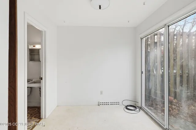a view of a bathroom with a tub and shower