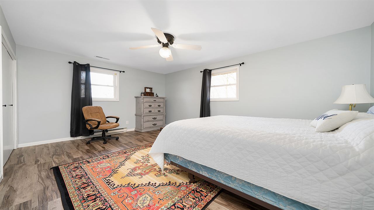 1989 Grand Detour Road Dixon, IL 61021 - Photo 15 of 39 a bedroom with a bed and wooden floor
