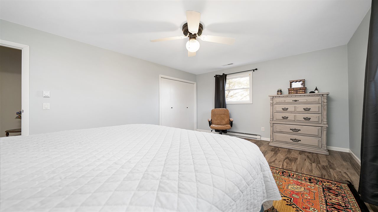 1989 Grand Detour Road Dixon, IL 61021 - Photo 16 of 39 a bed room with a bed and a dresser