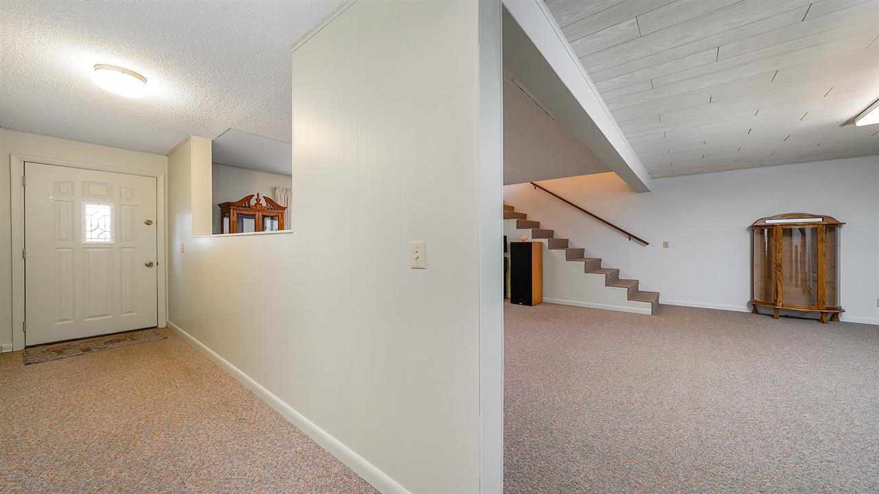 1989 Grand Detour Road Dixon, IL 61021 - Photo 19 of 39 an empty room with staircase and a ceiling fan