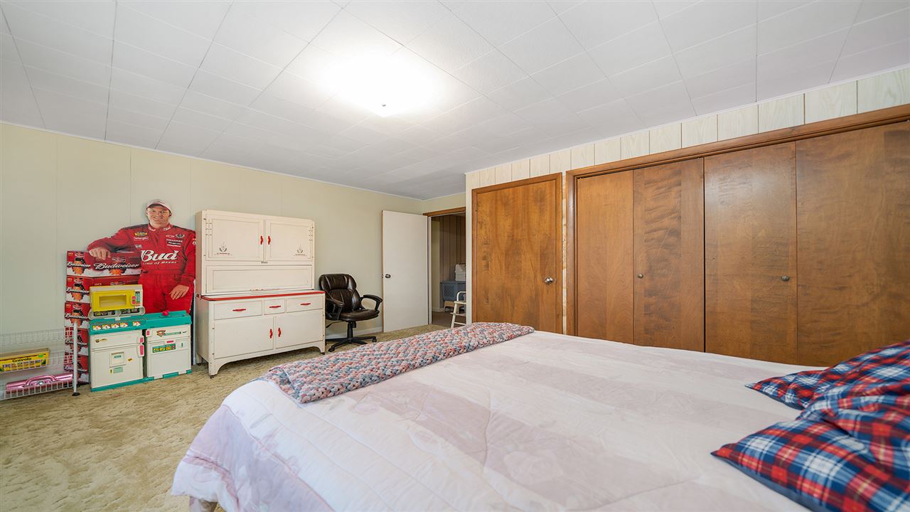 1989 Grand Detour Road Dixon, IL 61021 - Photo 24 of 39 a bedroom with a bed and a closet