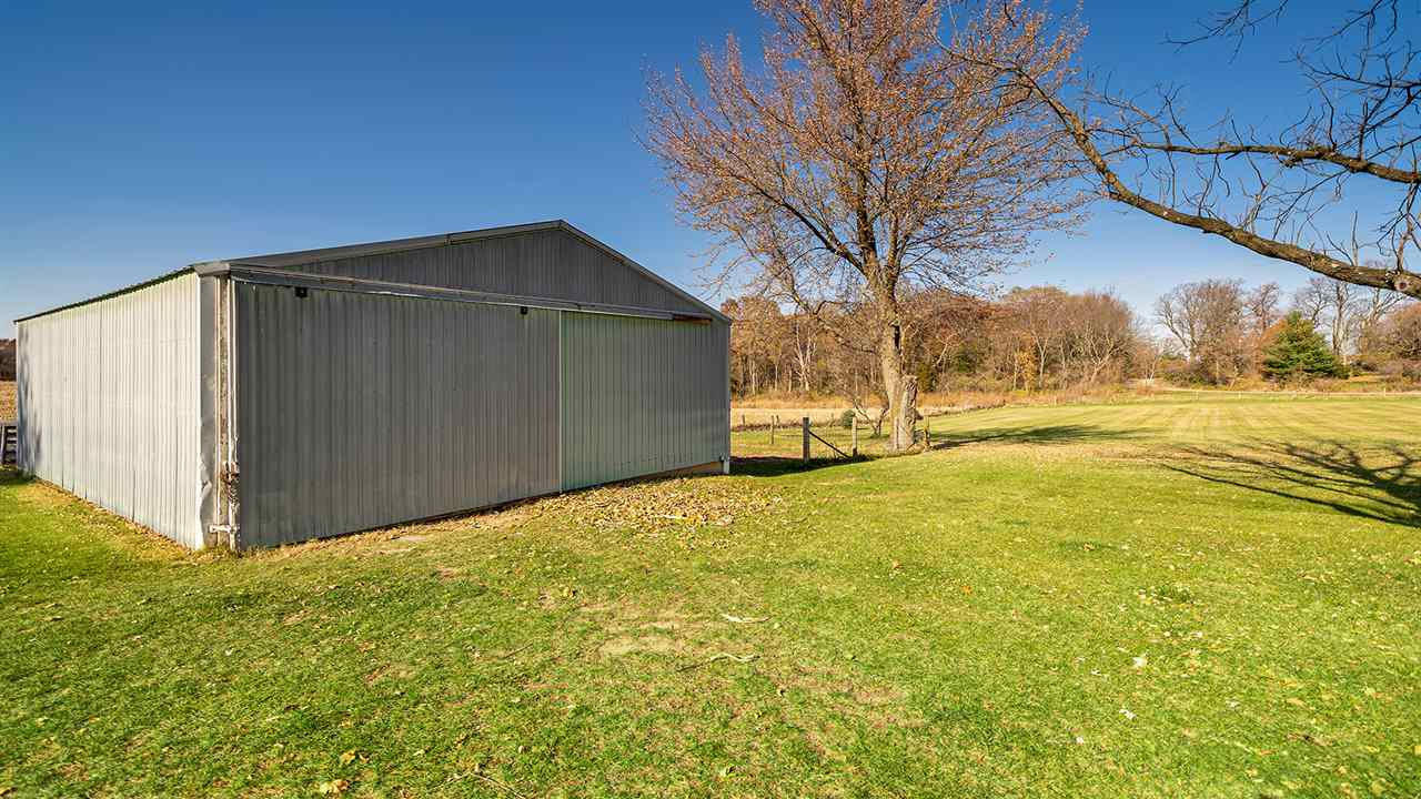 1989 Grand Detour Road Dixon, IL 61021 - Photo 38 of 39 a backyard of a house with a yard and garage