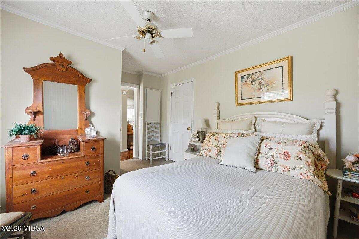 214 Howard Roberts Road Gray, GA 31032 - Photo 23 of 36 a bedroom with a bed and a dresser