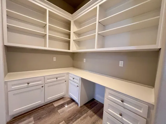a hallway with cabinets