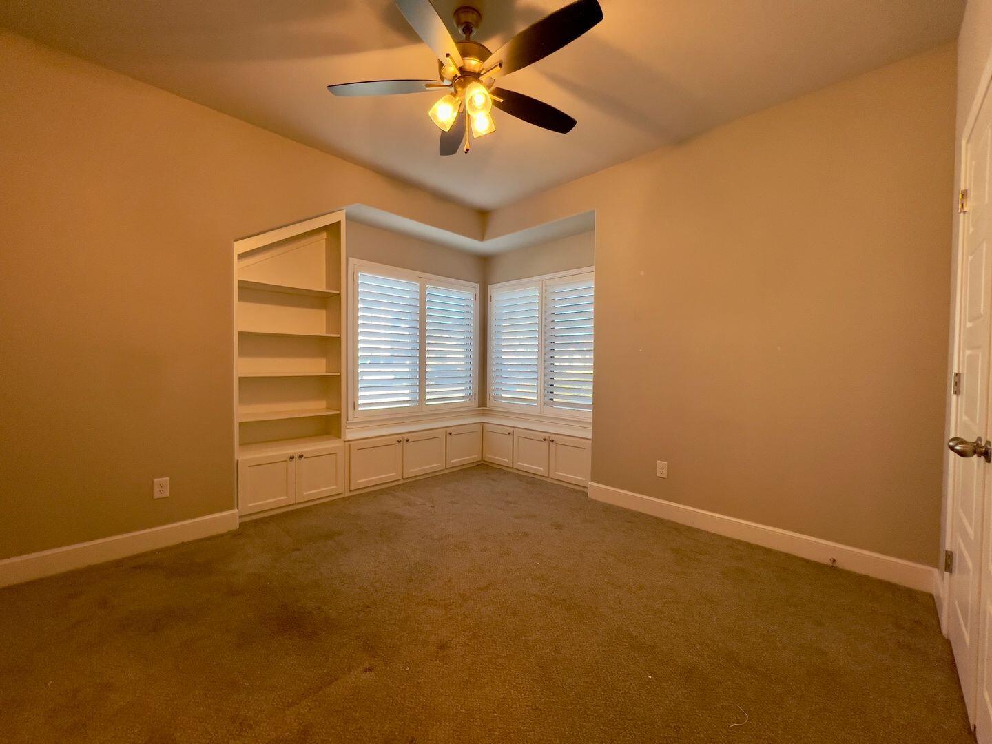 7817 57th Street Lubbock, TX 79407 - Photo 14 of 21 a view of an empty room with a window