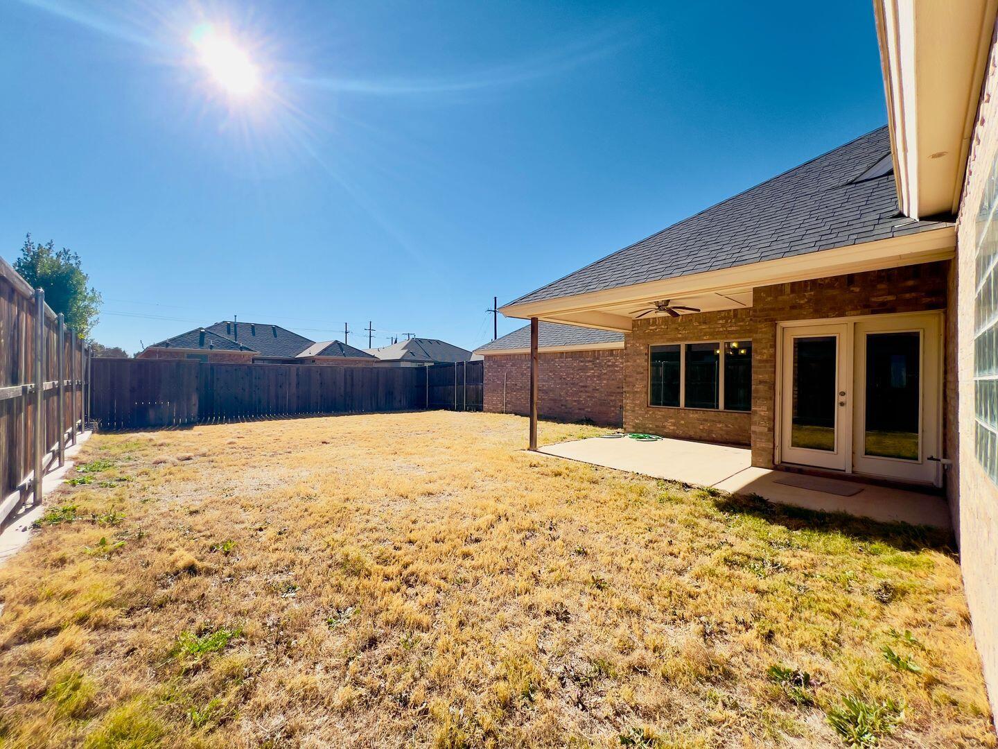 7817 57th Street Lubbock, TX 79407 - Photo 19 of 21 a big yard with an outdoor space