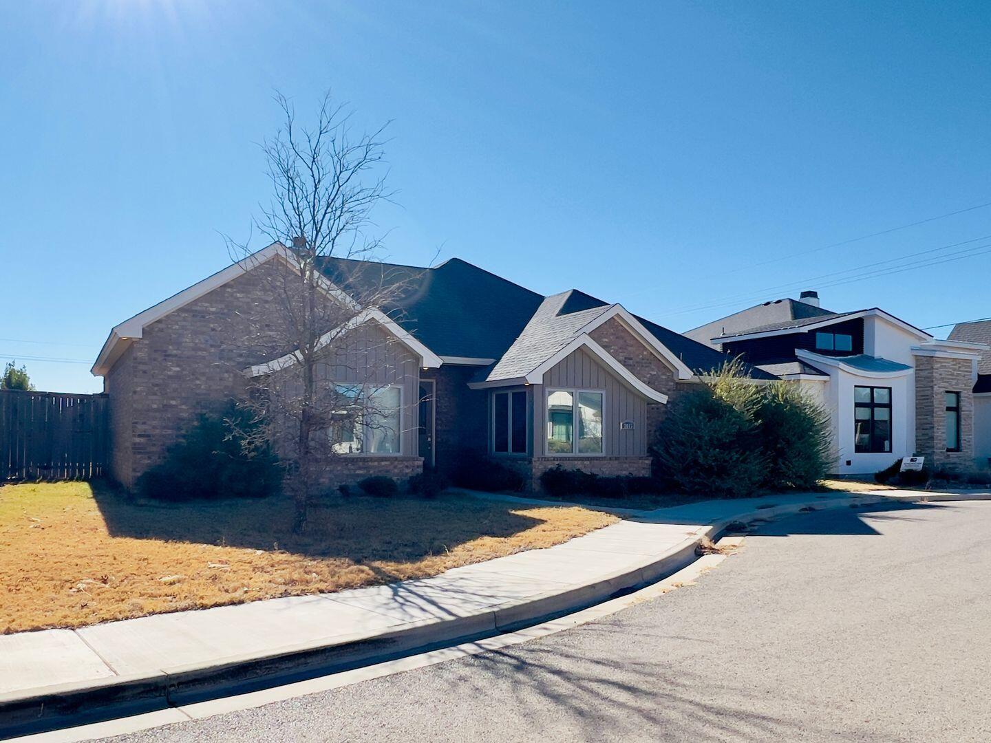 7817 57th Street Lubbock, TX 79407 - Photo 2 of 21 a front view of a house with a yard