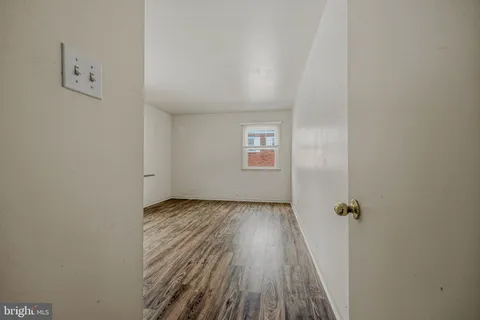 an empty room with a hardwood