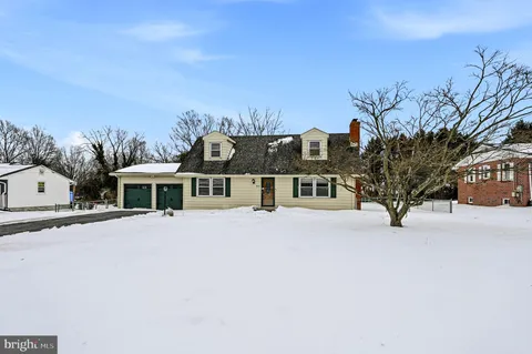 a view of a house with a snow in the yard