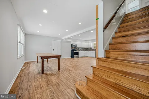 a view of kitchen with furniture and wooden floor