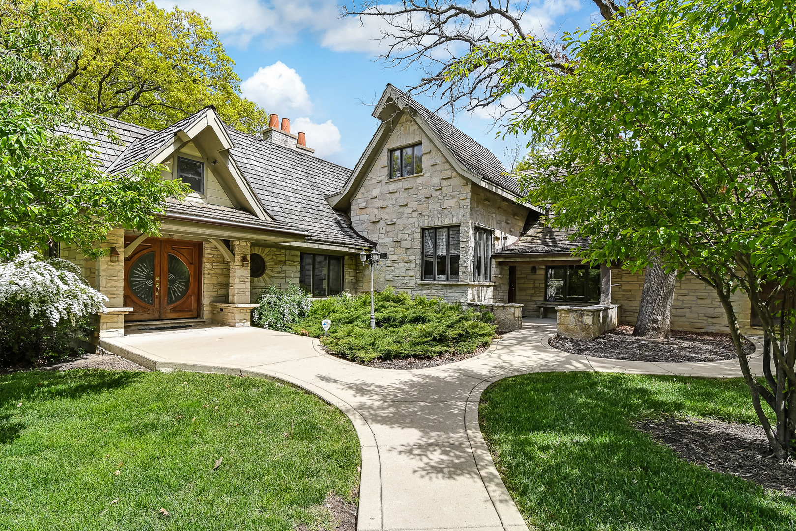 a front view of a house with garden