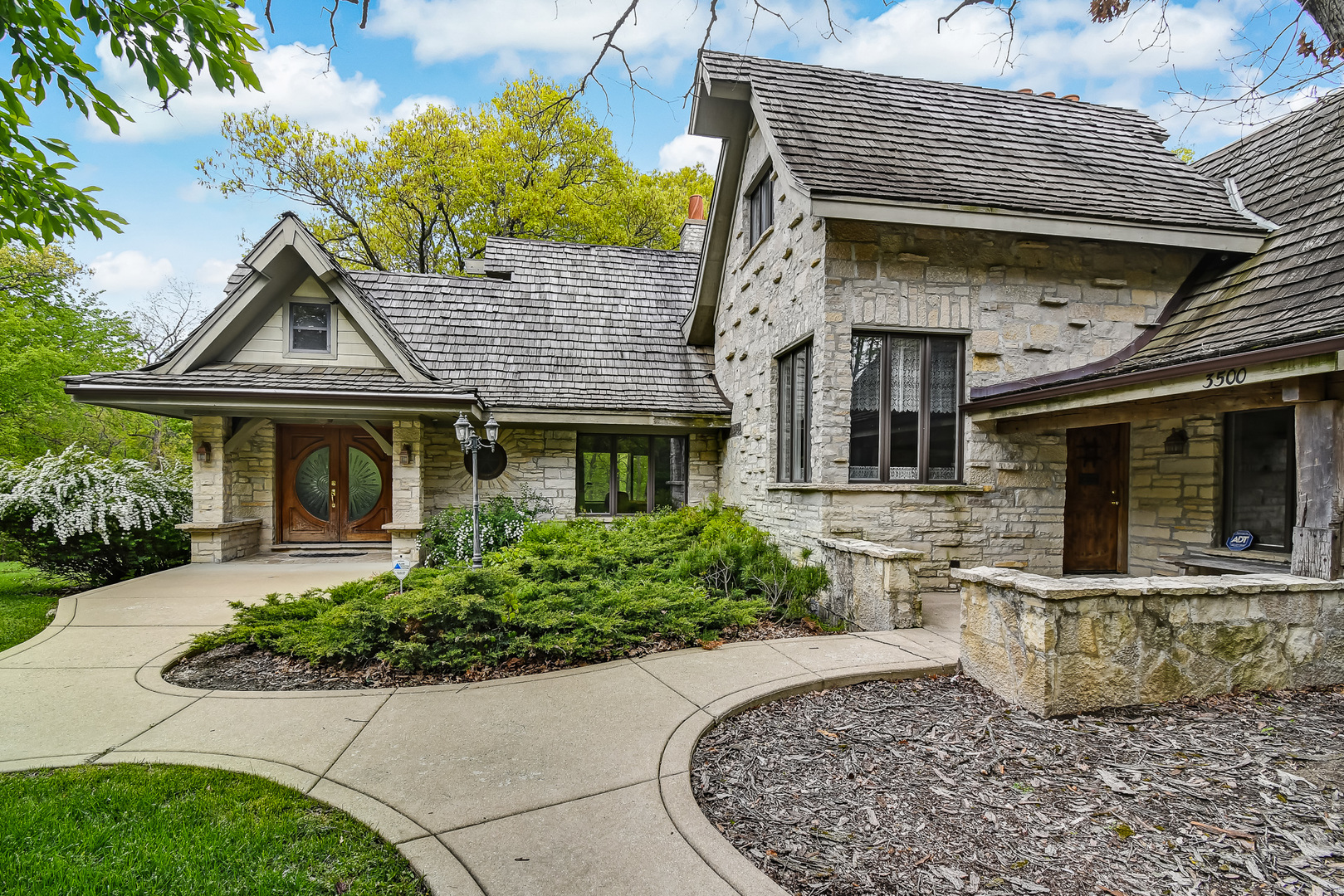 3500 Spring Road Oak Brook, IL 60523 - Photo 2 of 44 a front view of a house with garden