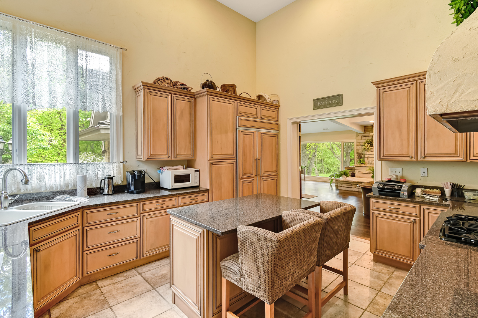 3500 Spring Road Oak Brook, IL 60523 - Photo 22 of 44 a kitchen with granite countertop a sink stove and cabinets