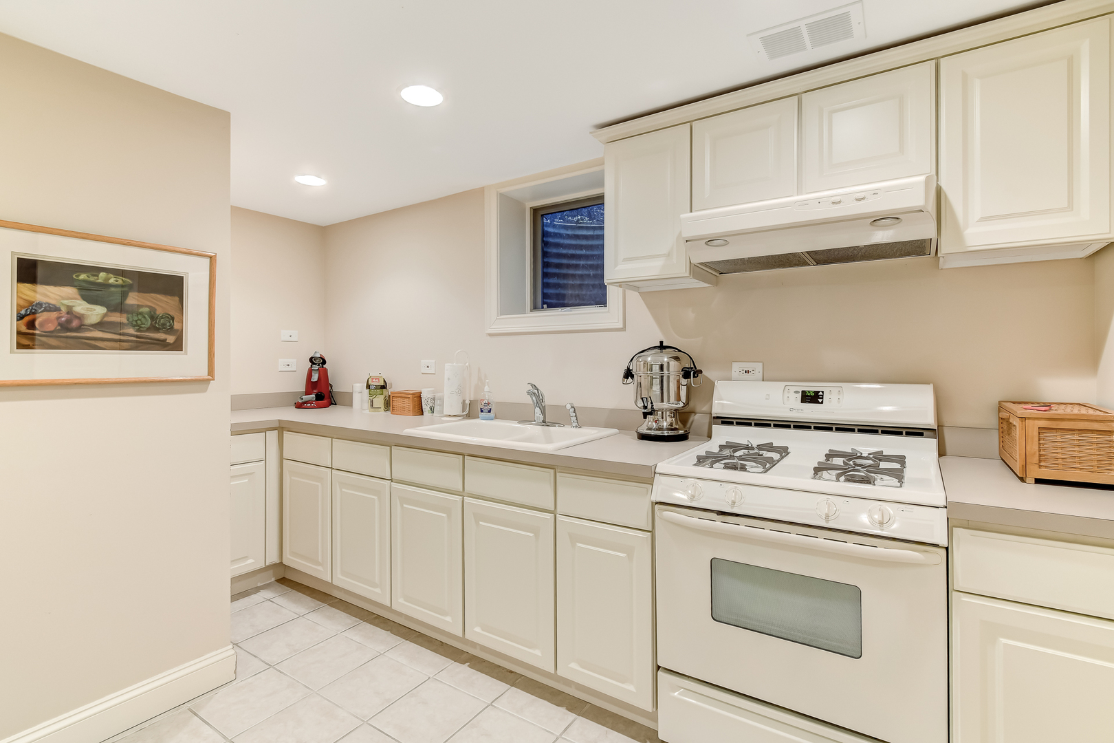 3500 Spring Road Oak Brook, IL 60523 - Photo 26 of 44 a kitchen with white cabinets and sink
