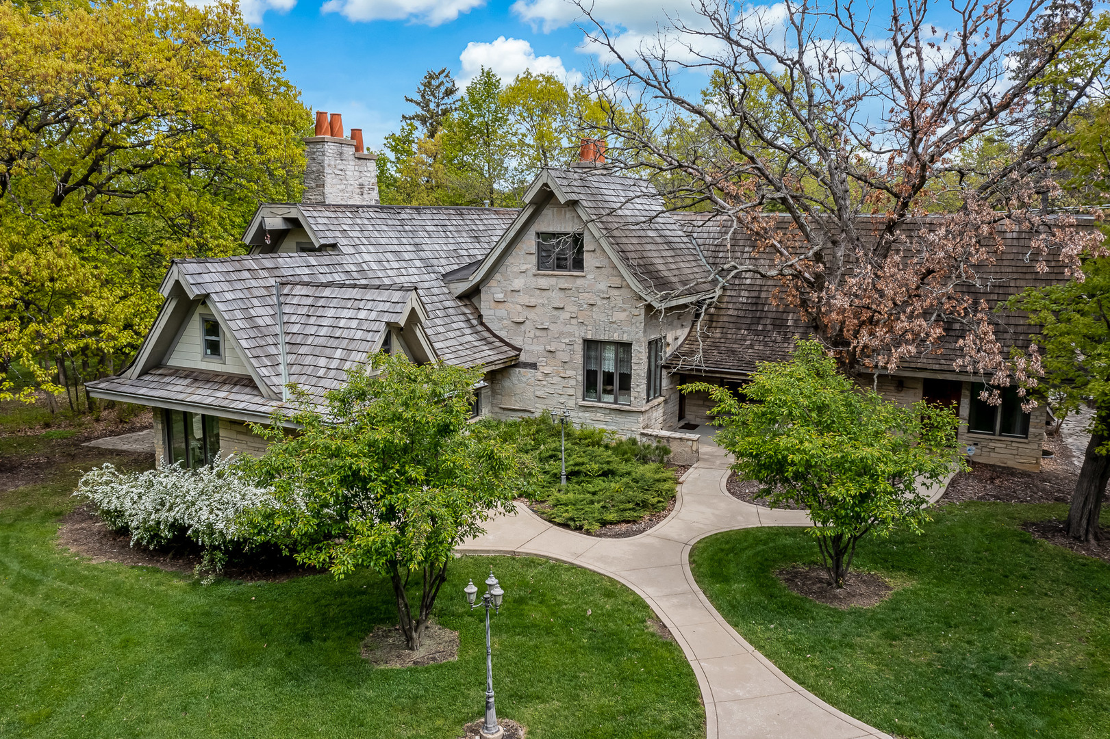 3500 Spring Road Oak Brook, IL 60523 - Photo 37 of 44 a aerial view of a house with a big yard plants and large trees