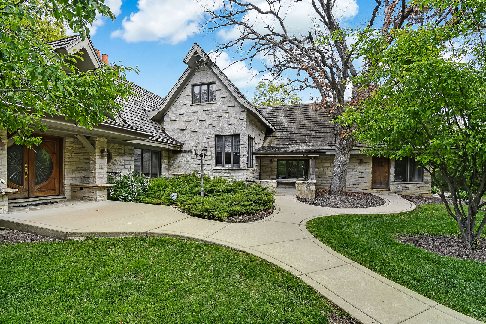 3500 Spring Road Oak Brook, IL 60523 - Photo 5 of 44 a front view of a house with yard and green space
