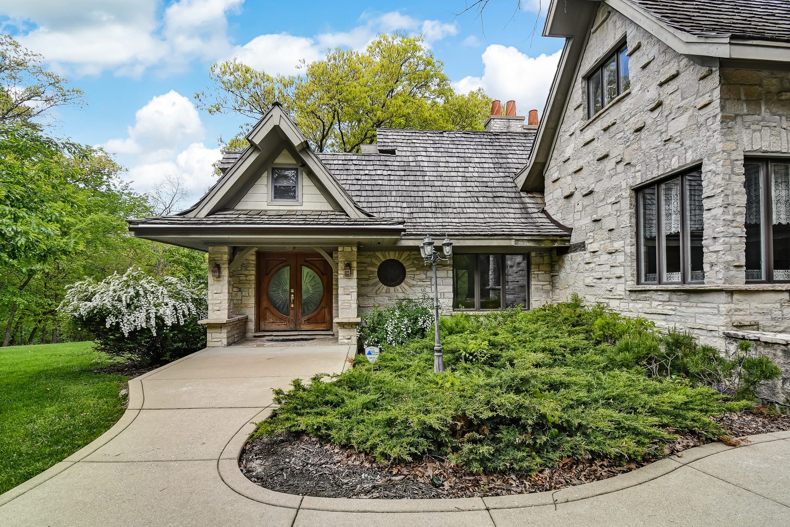 3500 Spring Road Oak Brook, IL 60523 - Photo 6 of 44 a front view of a house with garden