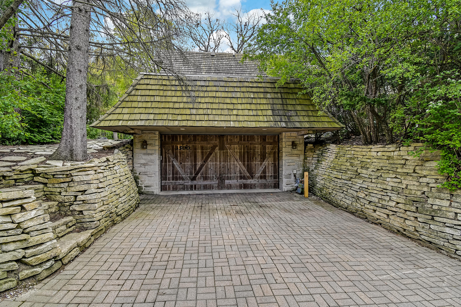 3500 Spring Road Oak Brook, IL 60523 - Photo 7 of 44 a front view of a house with a garden