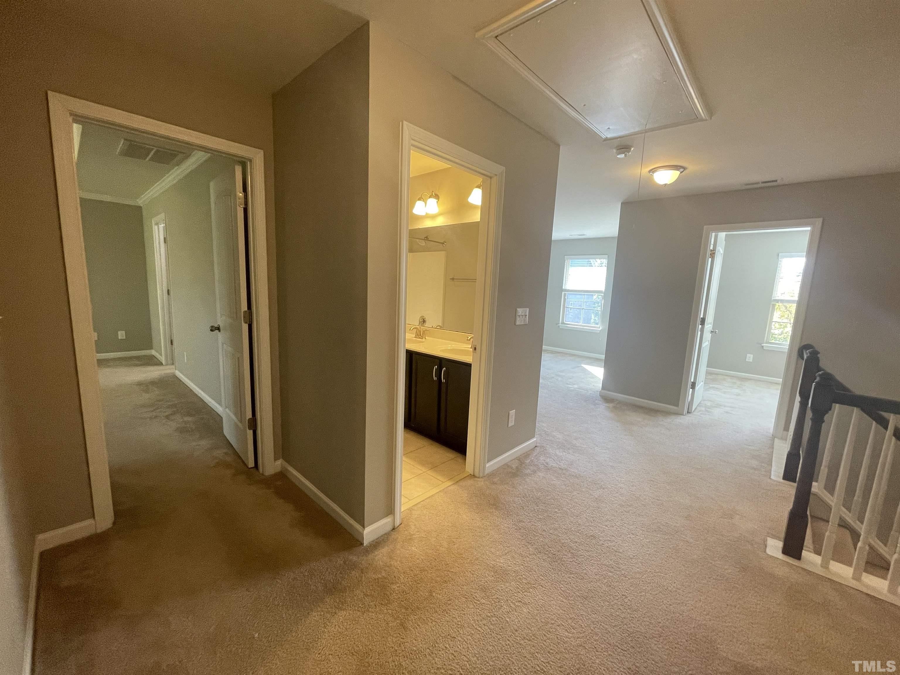 3928 Valley Side Court Cary, NC 27519 - Photo 12 of 26 an empty room with a bathroom and mirror