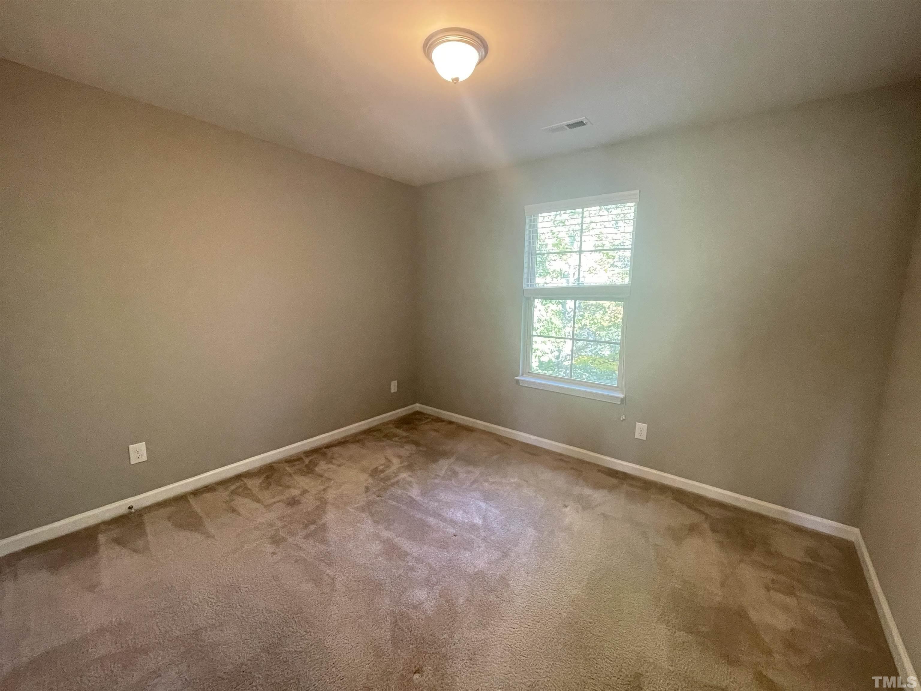 3928 Valley Side Court Cary, NC 27519 - Photo 19 of 26 an empty room with a window