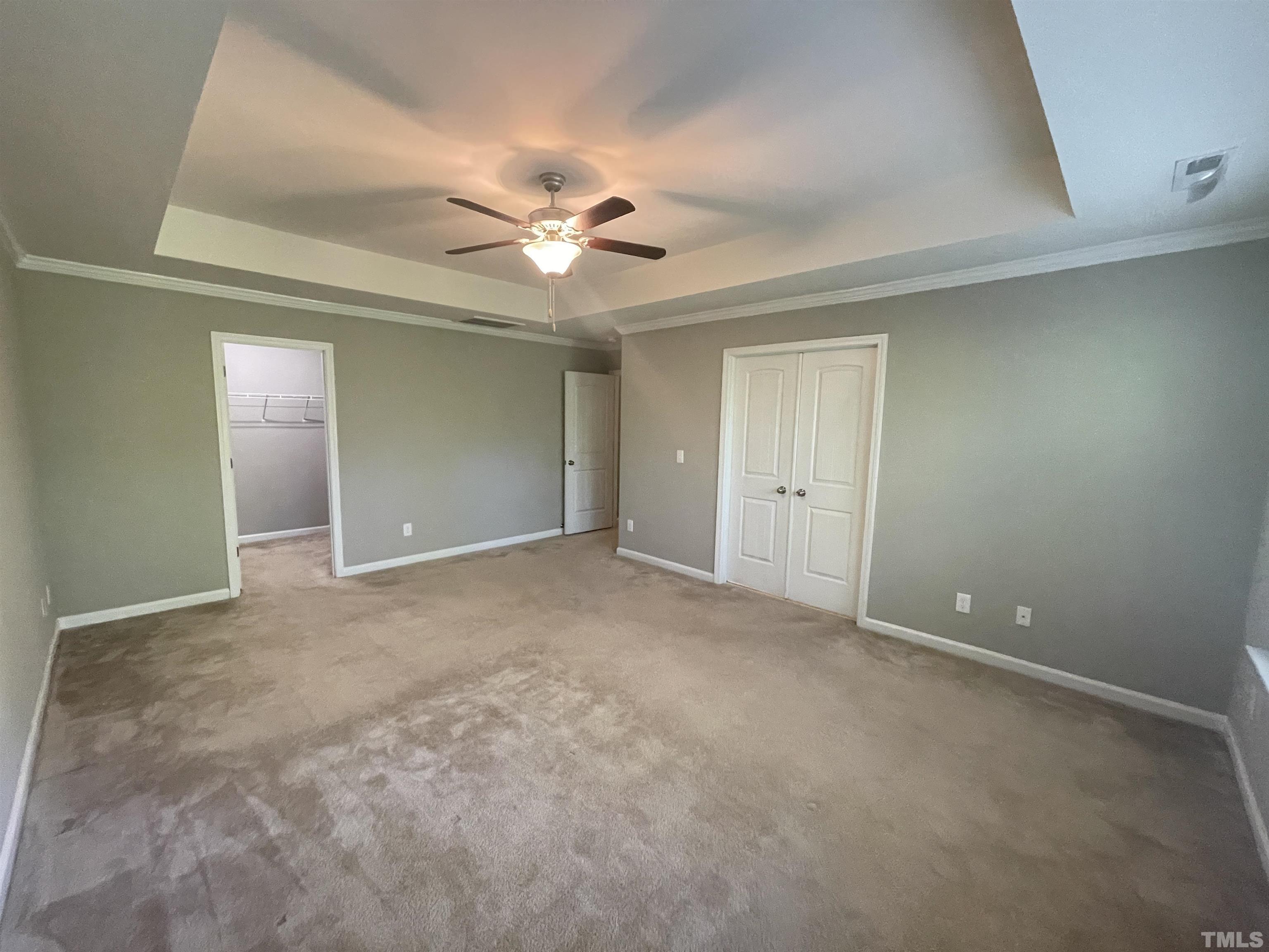 3928 Valley Side Court Cary, NC 27519 - Photo 21 of 26 an empty room with a ceiling fan and a window