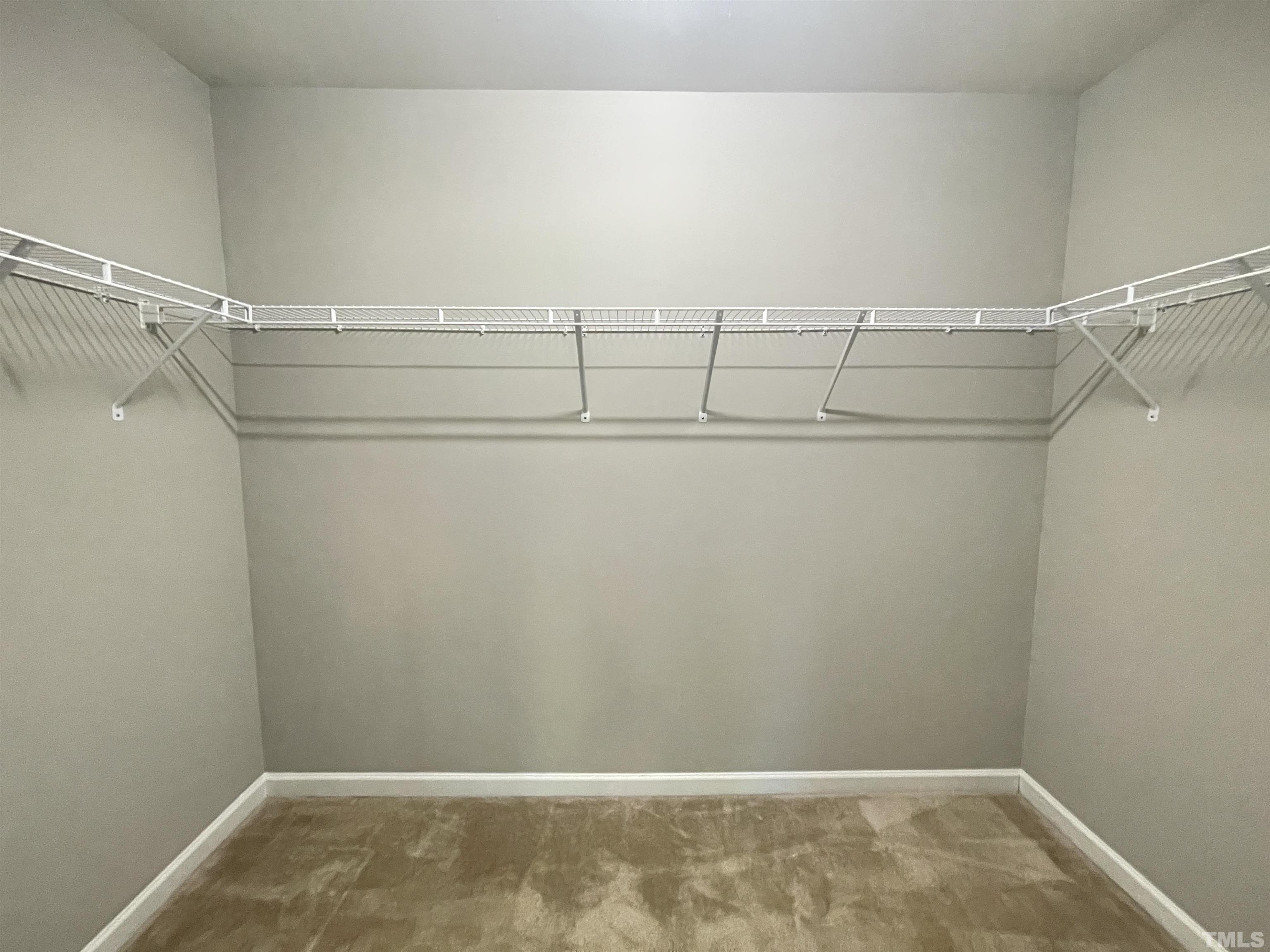 3928 Valley Side Court Cary, NC 27519 - Photo 22 of 26 a view of a room with racks on the wall