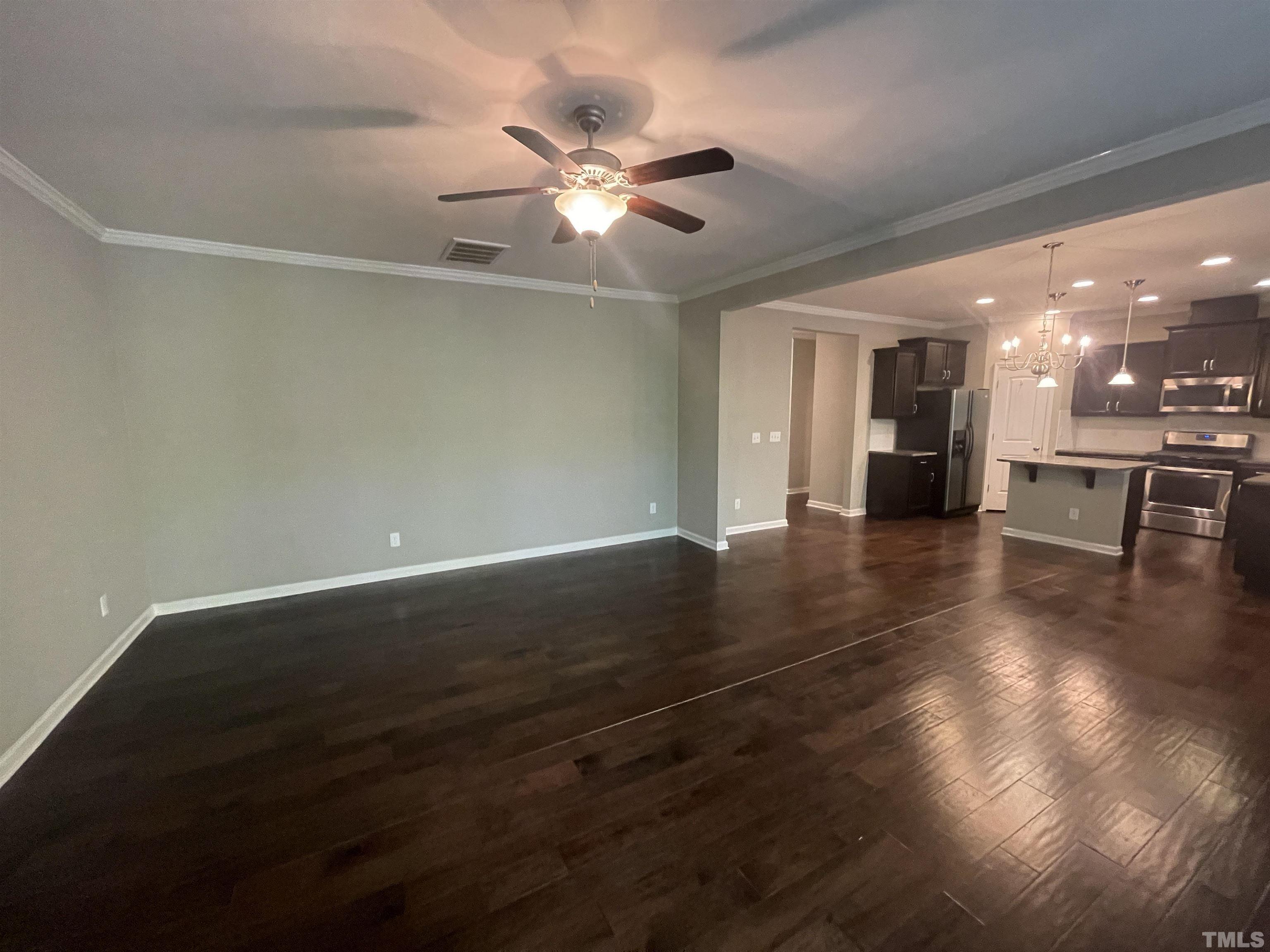 3928 Valley Side Court Cary, NC 27519 - Photo 8 of 26 wooden floor in an empty room with a window